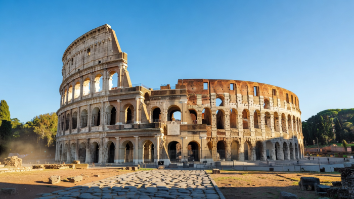 Historic Rome Colosseum under clear Mediterranean sky